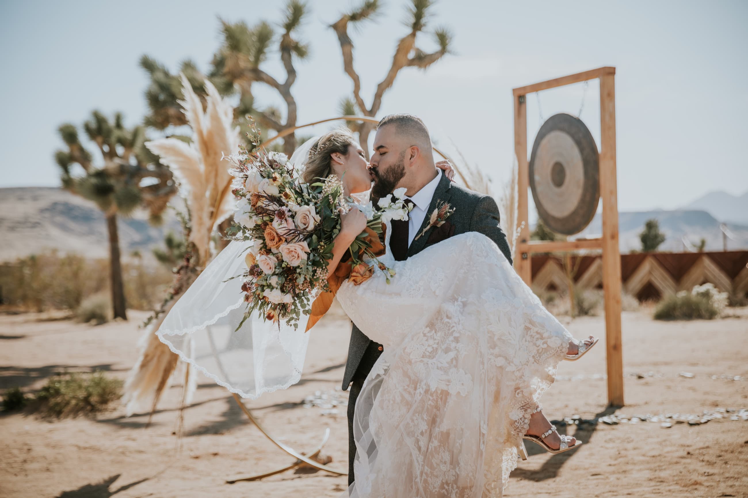Couple walking through dramatic landscape during sunset